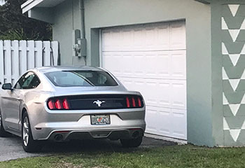 Residential garage door back on track and fully operational after repair in Coral Springs